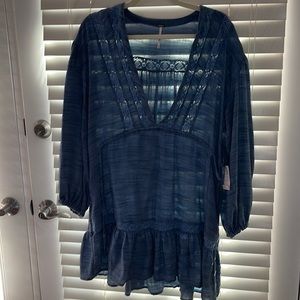 Free people dress. Blue deep v neck with long sleeves! Never worn! With tags!